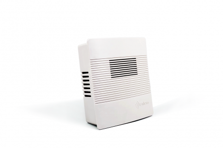 A white wall-mounted air conditioner, sleek and modern, installed in a room for efficient cooling and comfort.